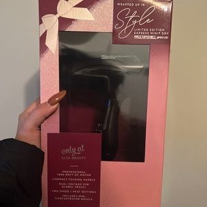 Paul Mitchell hair below dryer.